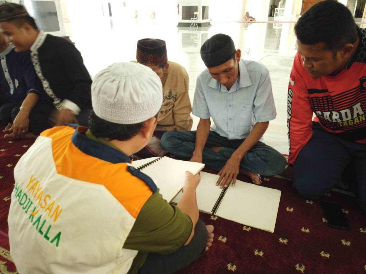 YHK Kolaborasi ITMI Gelar Program Baca Quran Braille